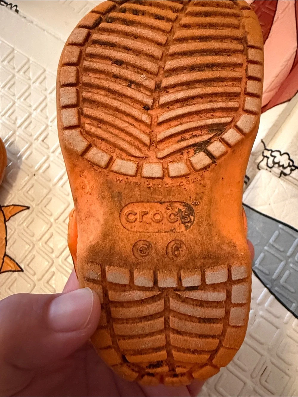 CROCS Kids Orange Patterned Clogs with Character Charms